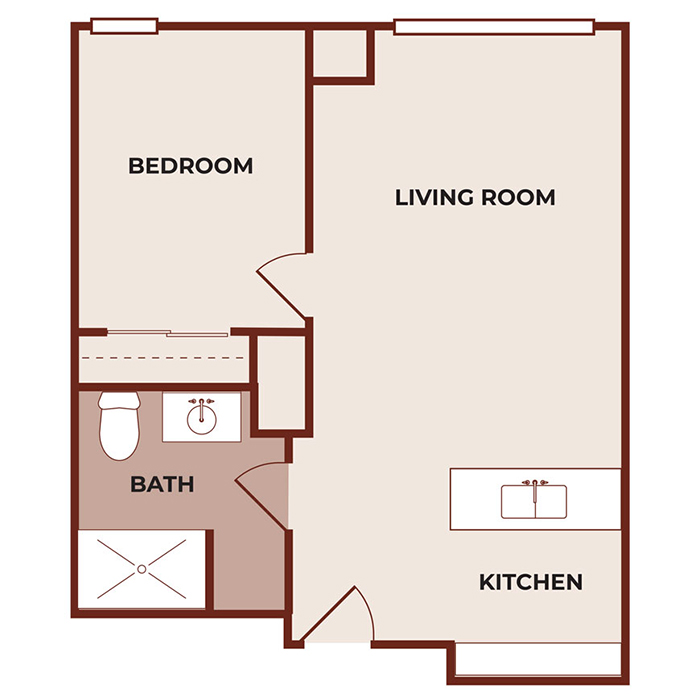 Floor plan of a one-bedroom apartment showing a bedroom, living room, kitchen, and bathroom with a shower, toilet, and sink. The kitchen and living room are open to each other.