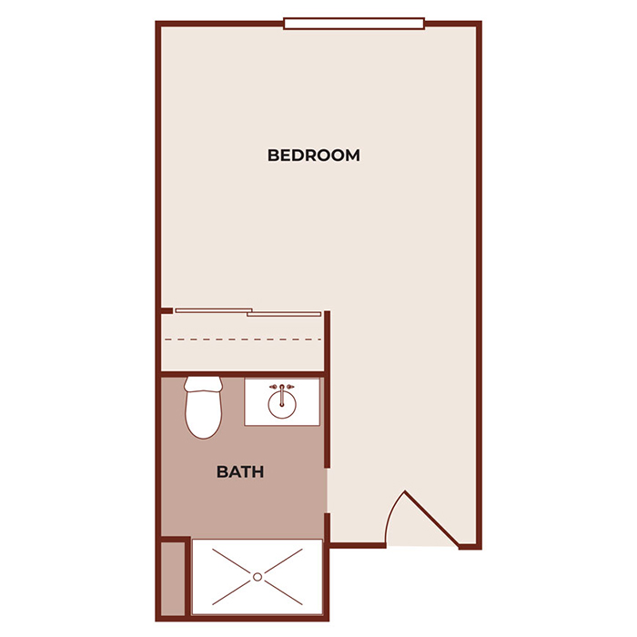Simple floor plan showing a rectangular bedroom with an attached bathroom. The bathroom contains a toilet, sink, and shower. The entrance to the room is through a door located near the bathroom.